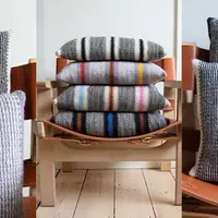 Полосатая подушка спицами Kuno‘s cushions
