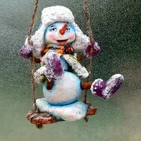 Снеговичок на качельках